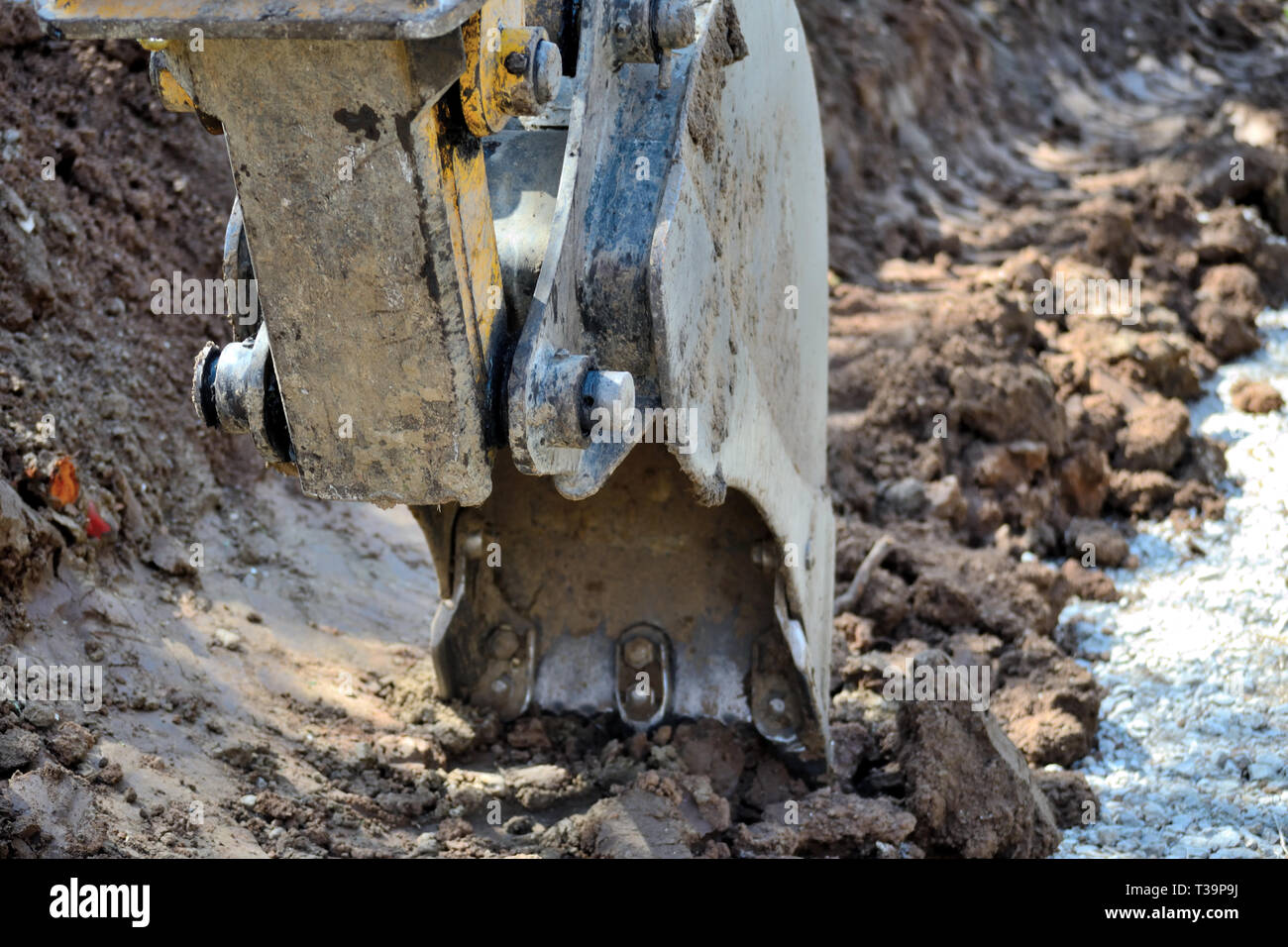 Excavator digging dirt ditch Stock Photo Alamy