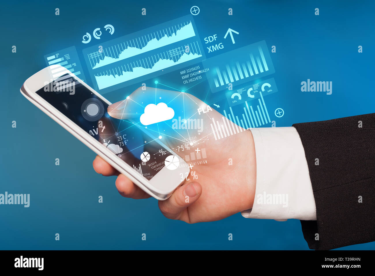 Hand using phone with cloud technology and linked information concept Stock Photo