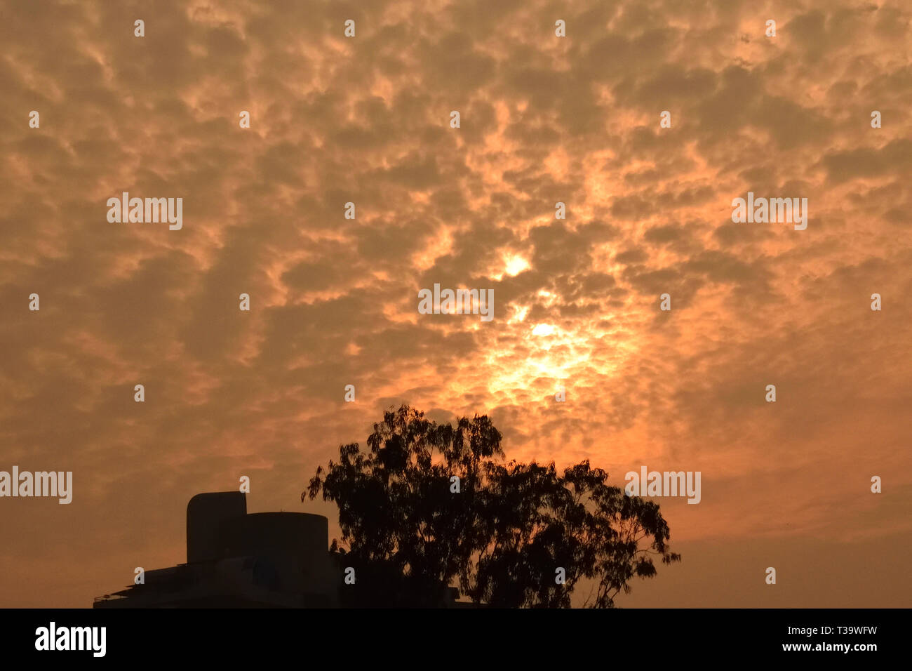 Delightful and colourful patterns in the sky during sunrise Stock Photo