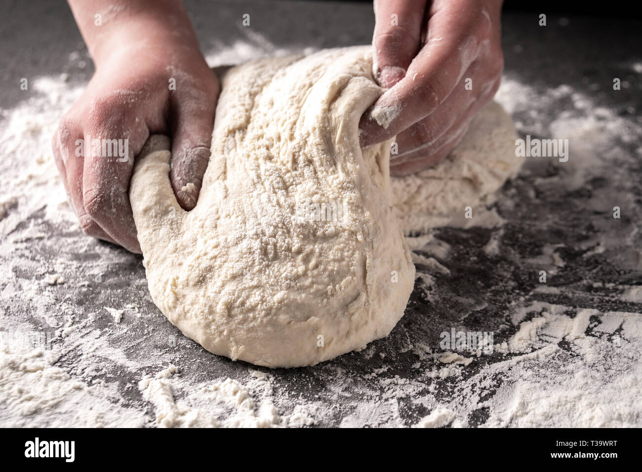 Making dough by female hands at bakery, Production of flour products ...