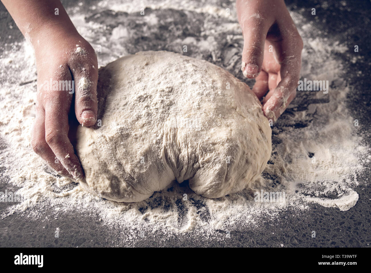 Making dough by female hands at bakery, Production of flour products ...