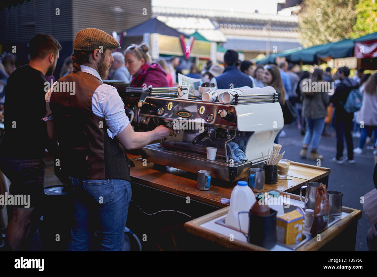 London, UK - November, 2018. Coffee stall in a crowded Borough Market, one of the oldest and largest food markets in London. Stock Photo