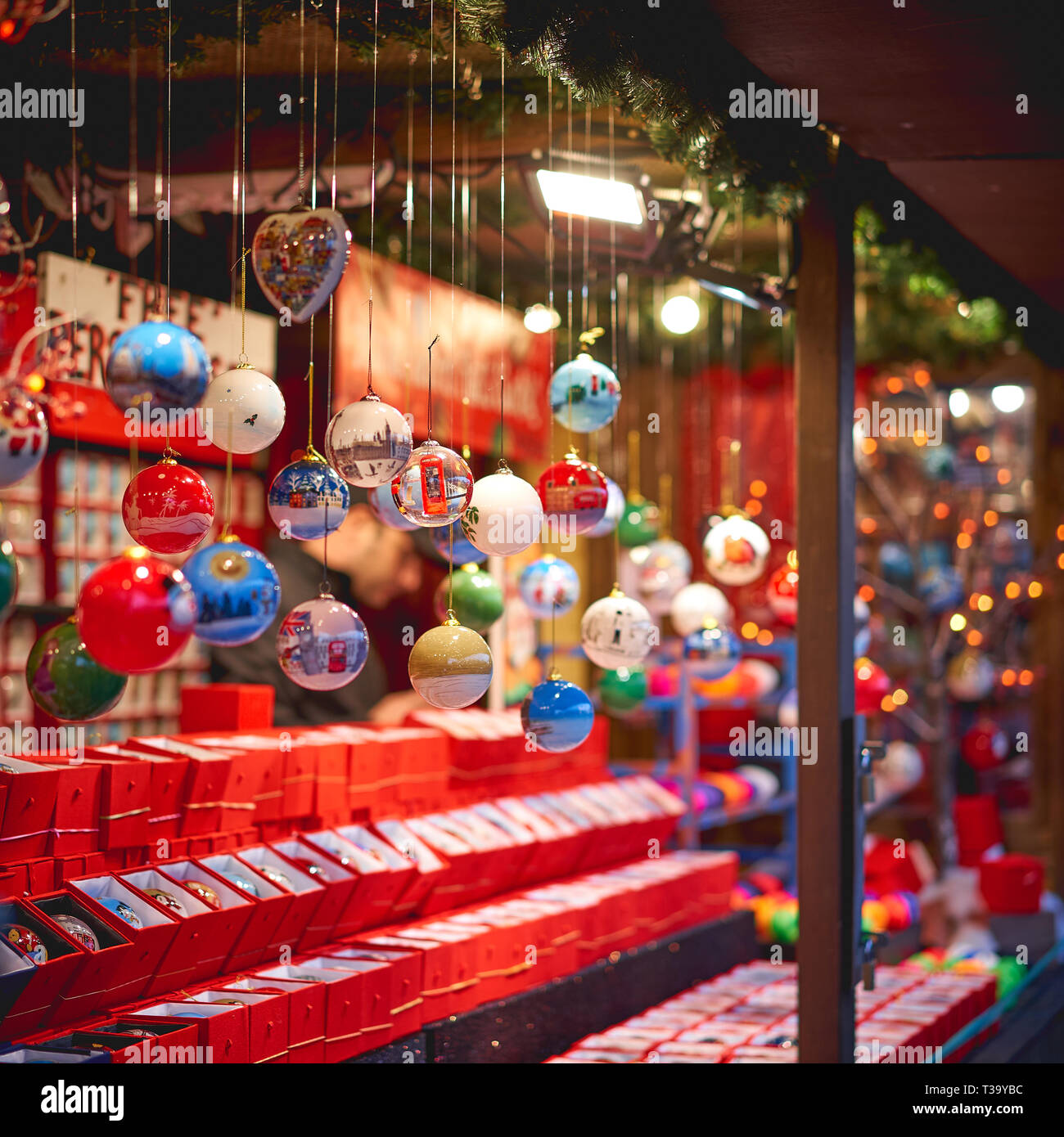 Decorative Christmas tree balls in a stall in a market. Selective focus