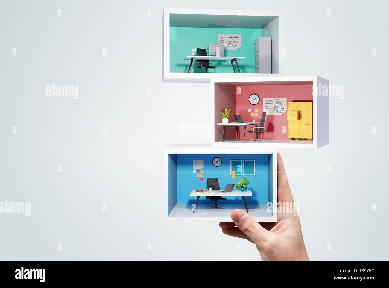 A man Holding up a stack of miniature business office rooms. Business workplace 3D concept illustration. Stock Photo