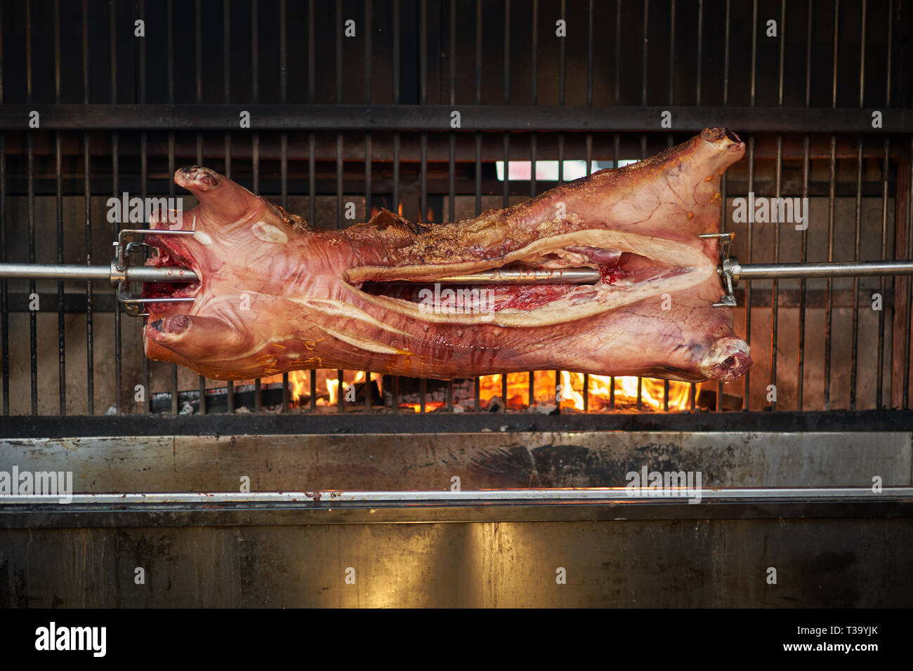 Whole hog on a roaster. Landscape format. Stock Photo