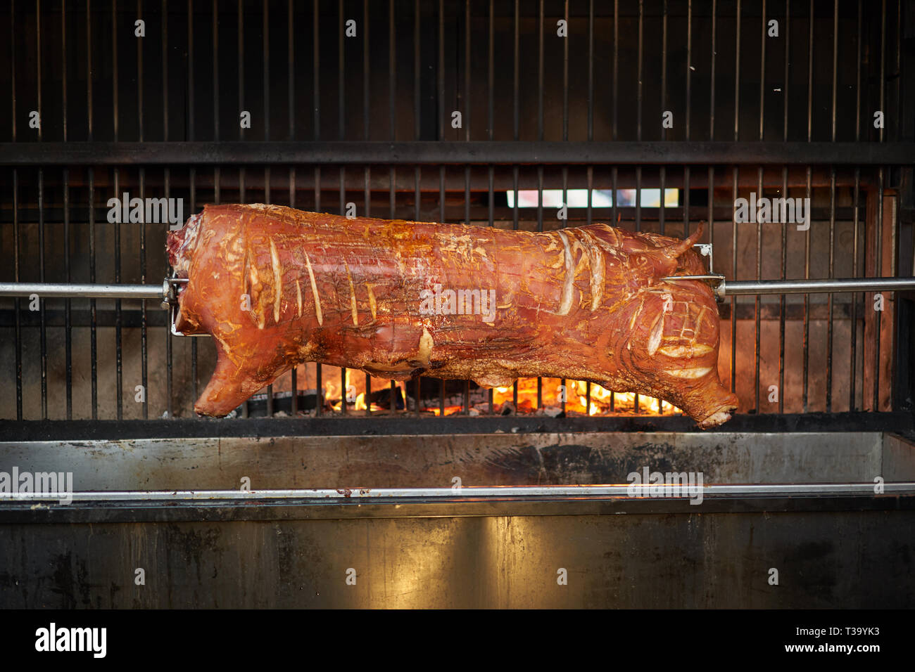 Whole hog on a roaster. Landscape format. Stock Photo