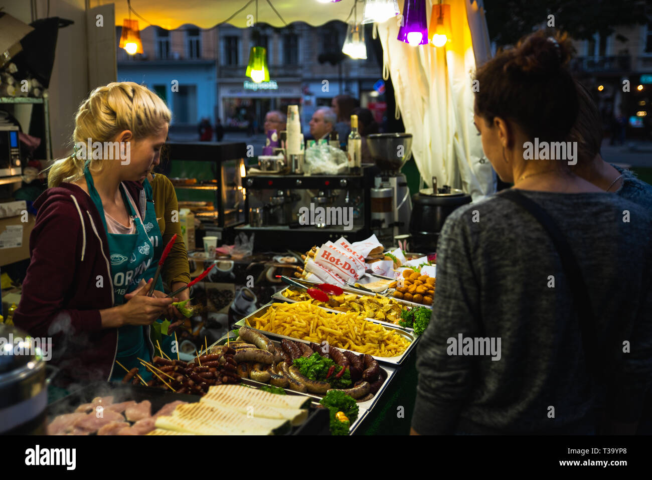 LVIV, UKRAINE - September 15, 2018: street food concept. people