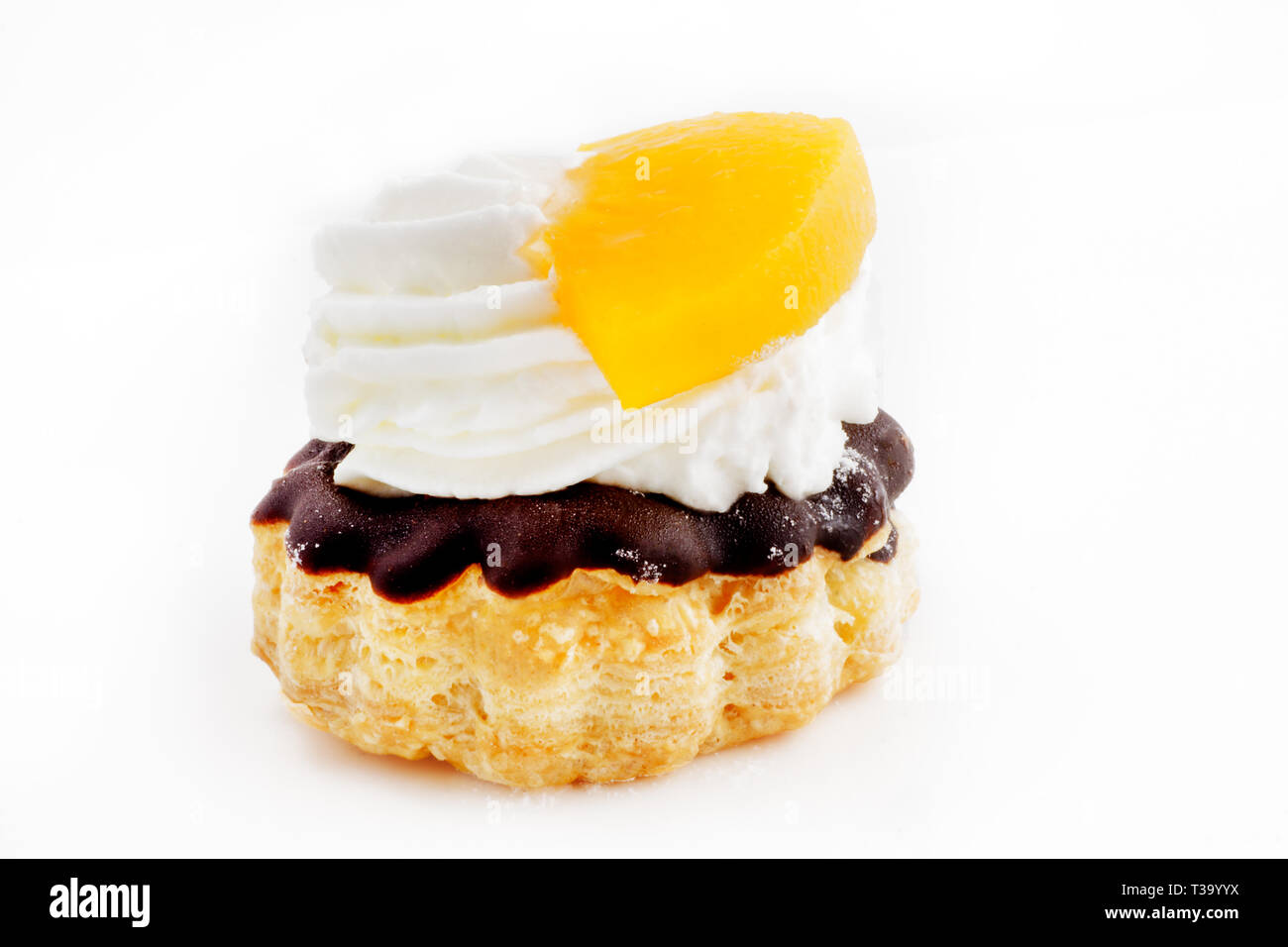 Mini puff pastry cake with fruit and cream filling Stock Photo