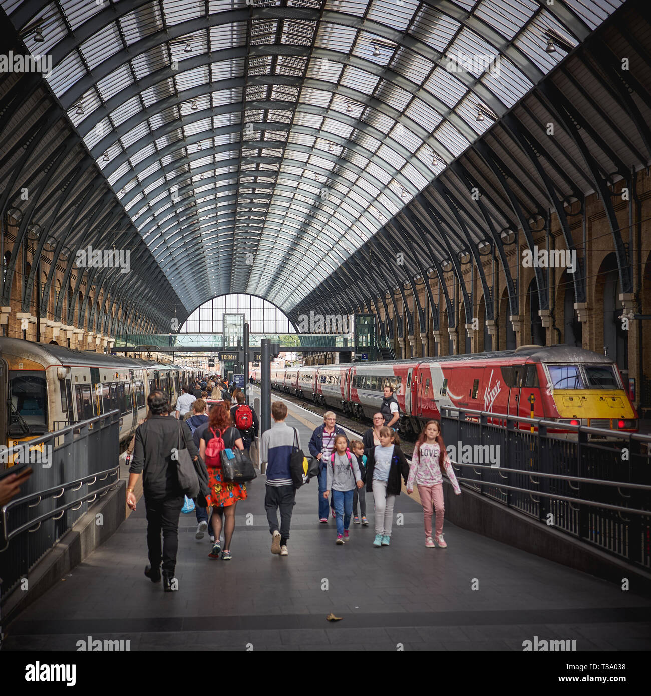 London, UK - December, 2018. Tourists and commuters in King's Cross Station, one of the busiest railway stations in London. Stock Photo