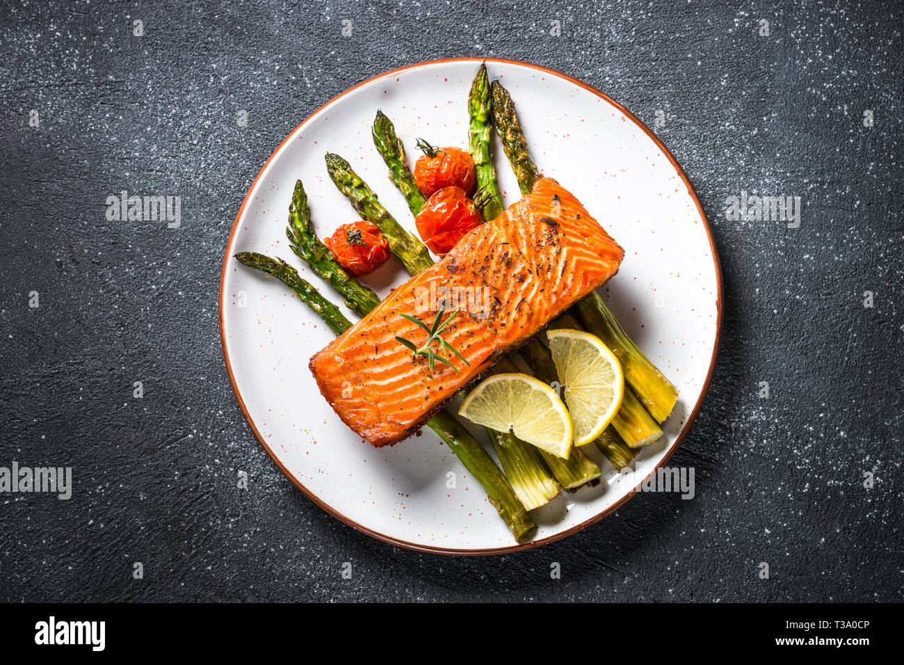 Baked salmon fish with asparagus top view Stock Photo Alamy