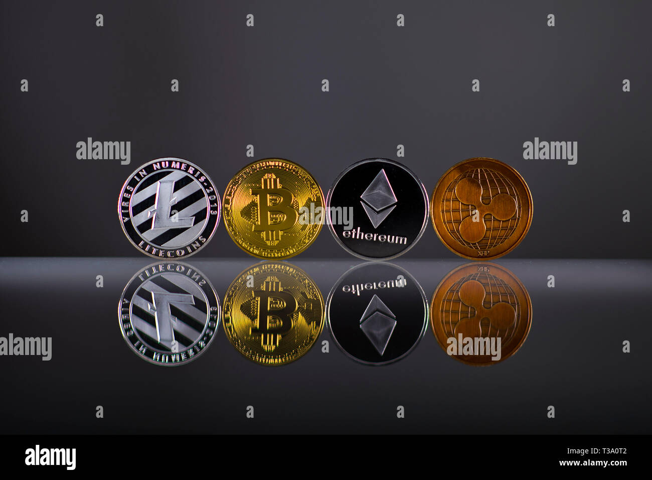 Bitcoin, Ripple, Litecoin, Ethereum prices, currency exchange rates on the  screen. Trading platform December 2025: Crypto currency exchange rates on  the screen. Bitcoin, Ripple, Litecoin, Ethereum price moves up and down.  Crypto