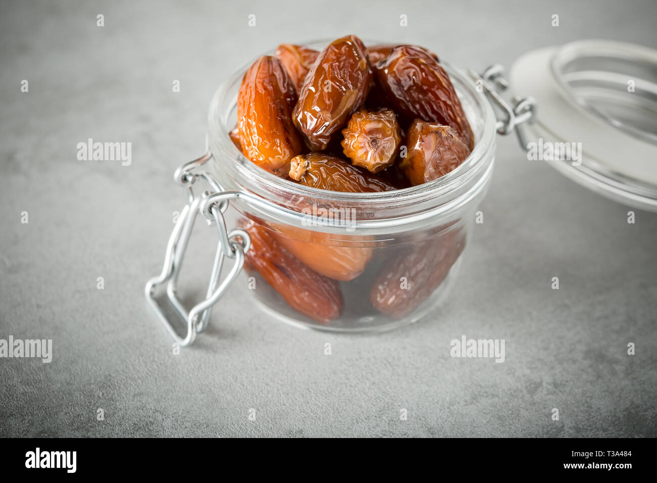 Blessed or kameen ramadan with dates fruit in a glass jar. Typical ...