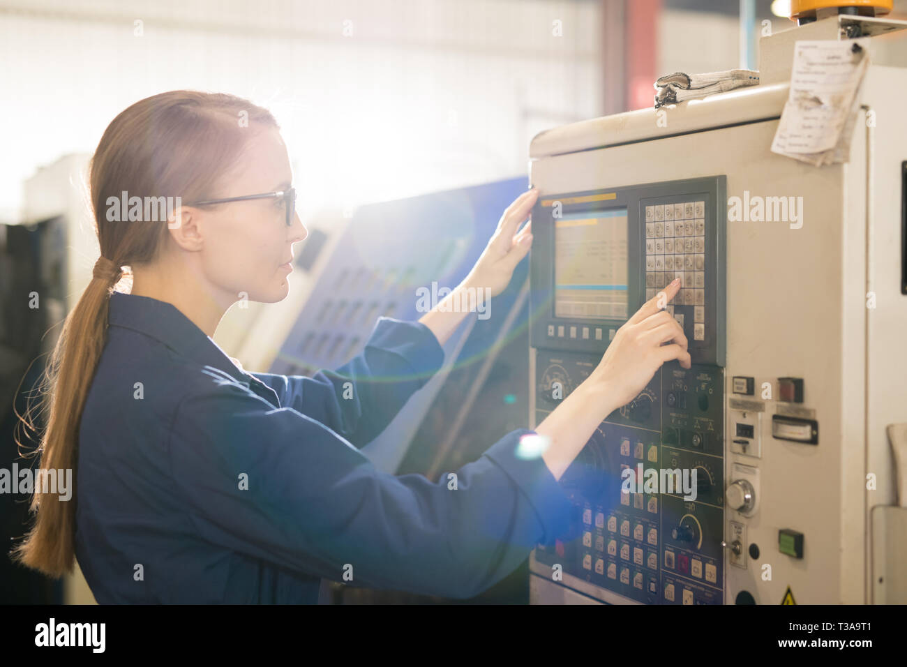 Pressing button on panel Stock Photo