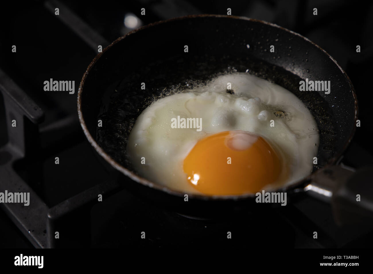 fried egg in saucepan Stock Photo