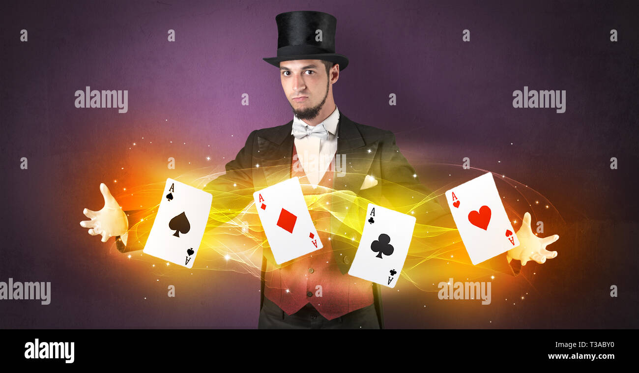 Illusionist in tails bandy play cards between his two hands Stock Photo ...