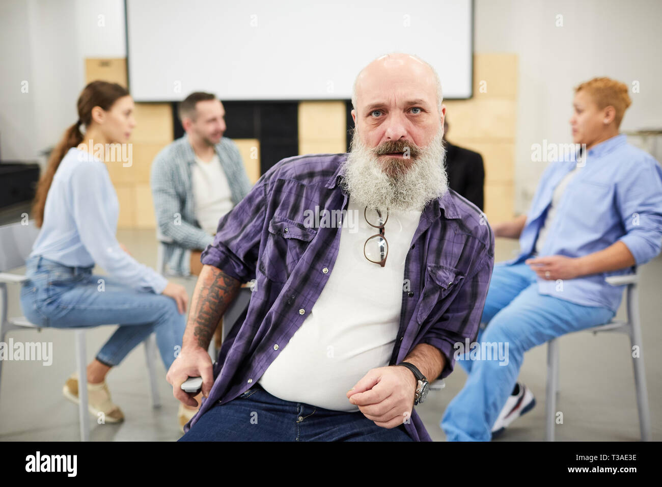 Tough Bearded Man in Therapy Session Stock Photo