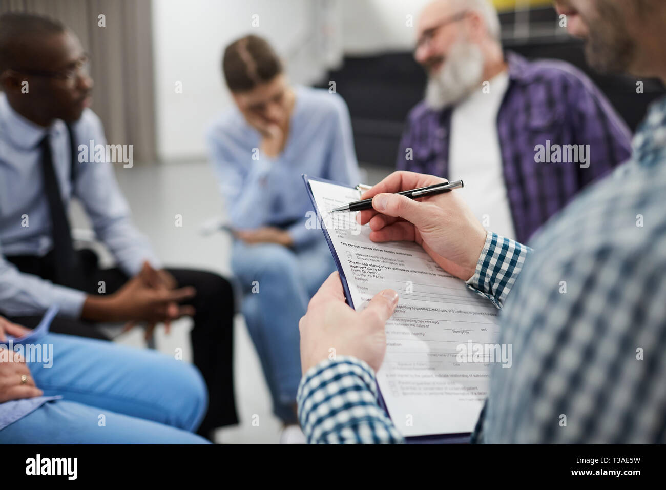 Closeup of Psychologist in Support Group Stock Photo