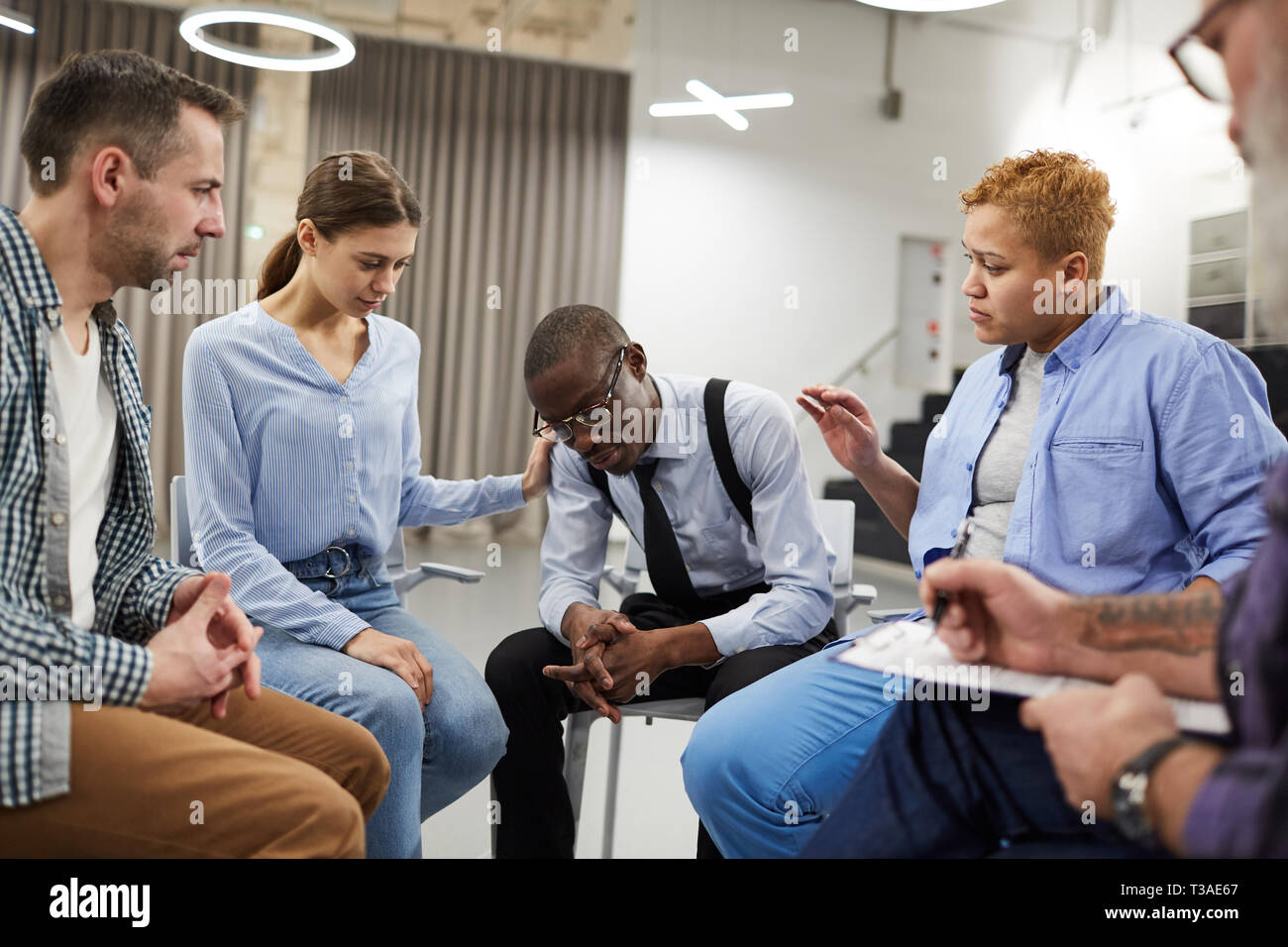 African Man in Support Group Stock Photo