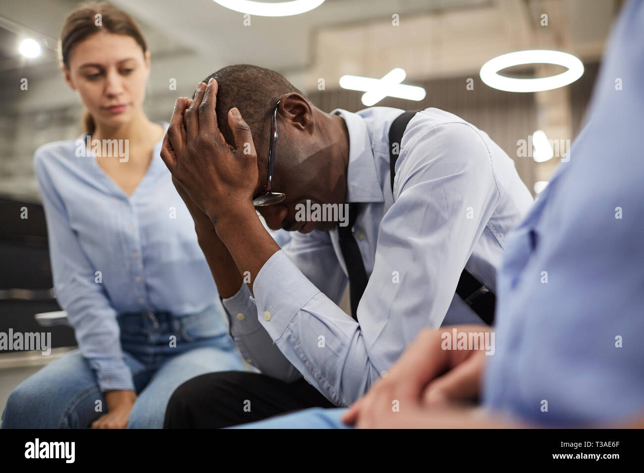 Depressed African Man in Therapy Stock Photo