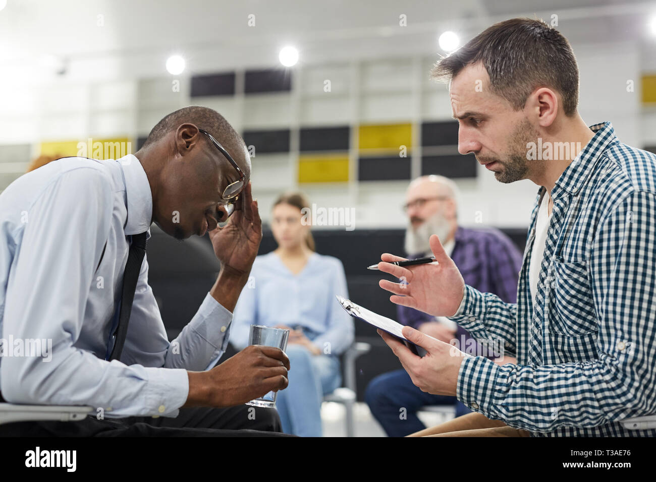 African Man in Mental Health Consultation Stock Photo