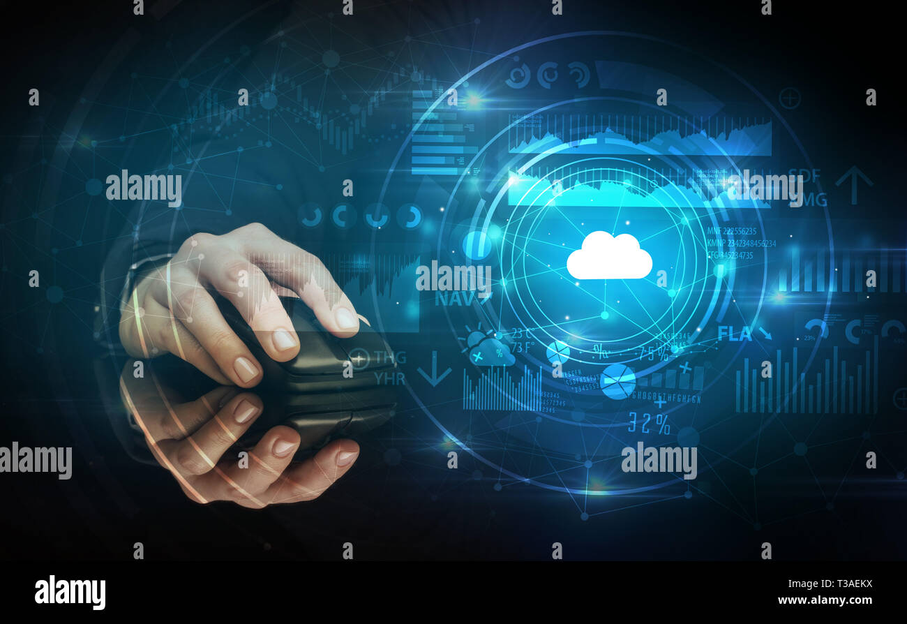 Hand using wireless mouse with cloud technology concept and dark background Stock Photo