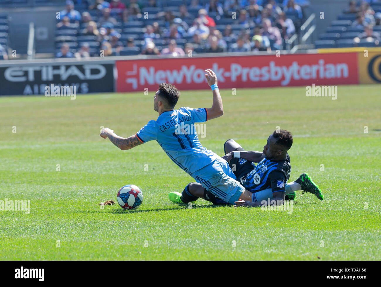 New York, NY - April 6, 2019: Valentin Castellanos (11) of NYCFC collides with Bacary Sagna (33) of Montreal Impact during regular MLS game at Yankee stadium Stock Photo