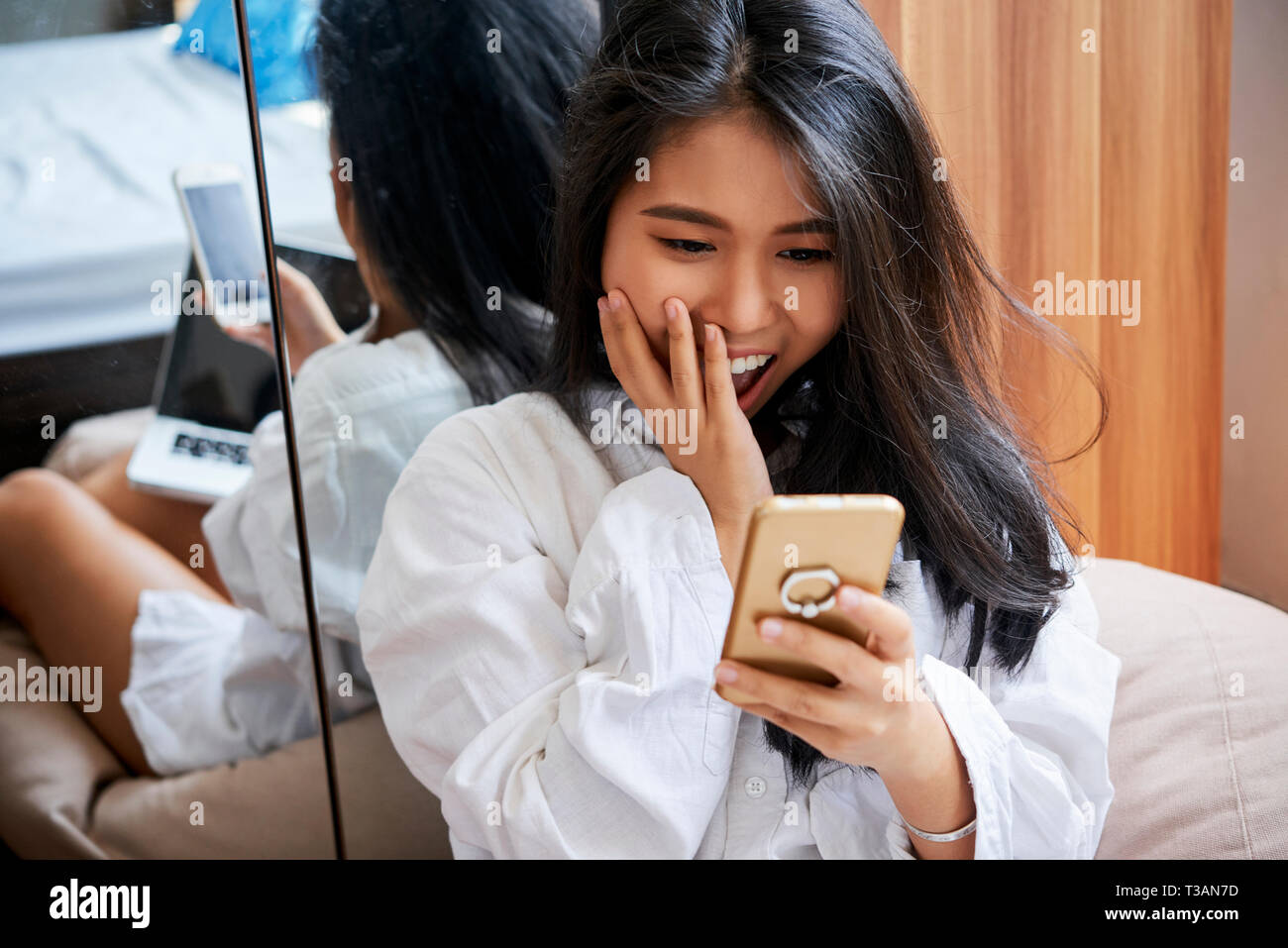 Young woman reading text message Stock Photo