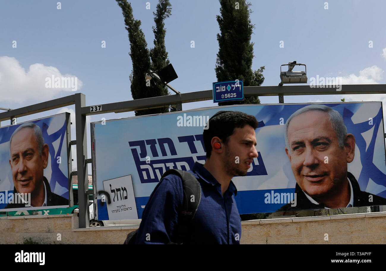 Jerusalem. 7th Apr, 2019. A man walks past a Likud Party election campaign poster depicting Israeli Prime Minister Benjamin Netanyahu in Jerusalem, on April 7, 2019. Credit: Muammar Awad/Xinhua/Alamy Live News Stock Photo