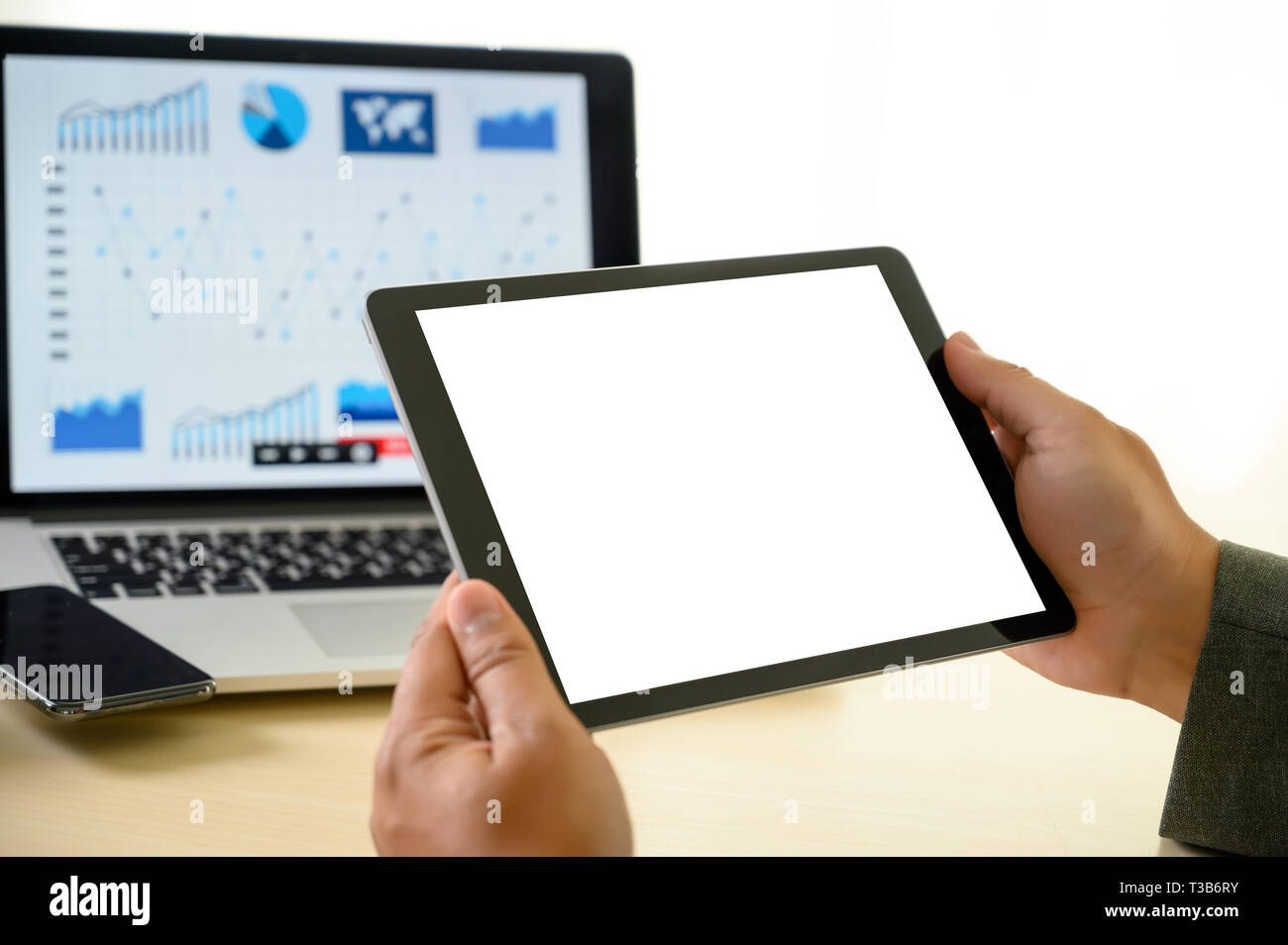 man  hands multitasking man using tablet close up close up working in office Stock Photo