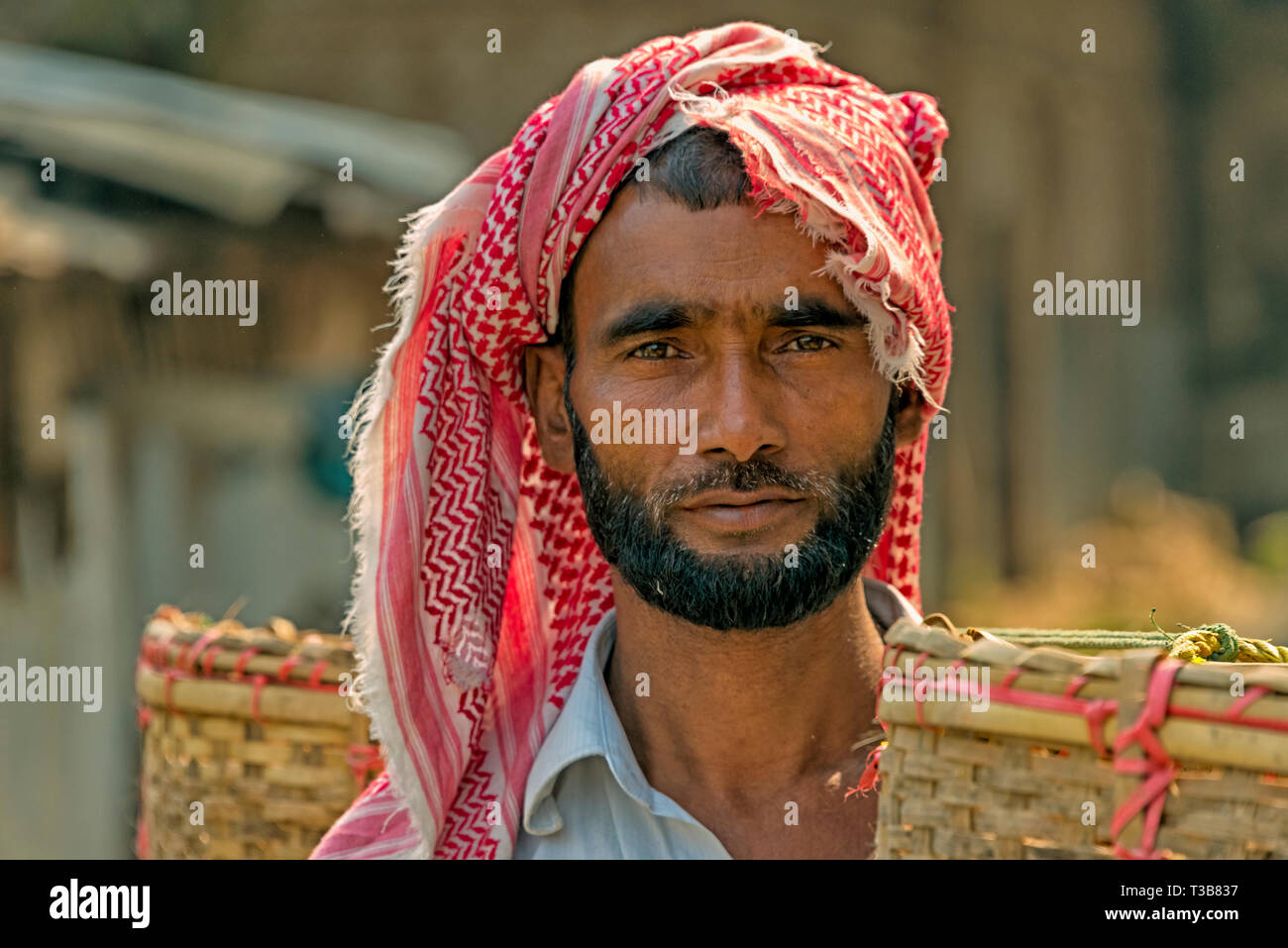 Tribe man carrying basket, Chimbuk Hill, Bandarban, Chittagong Division, Bangladesh Stock Photo