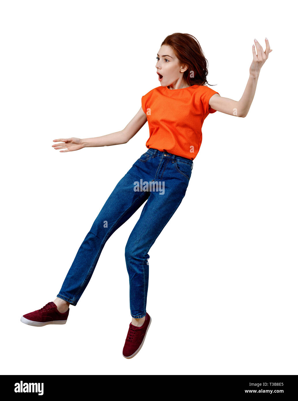 Full length ginger girl falls down with perplexity emotion Stock Photo Alamy