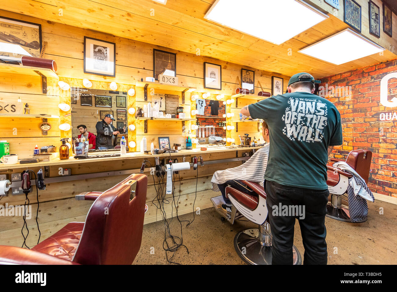 Style conscious men in Quarter West barbers shop in Pottinger's Entry