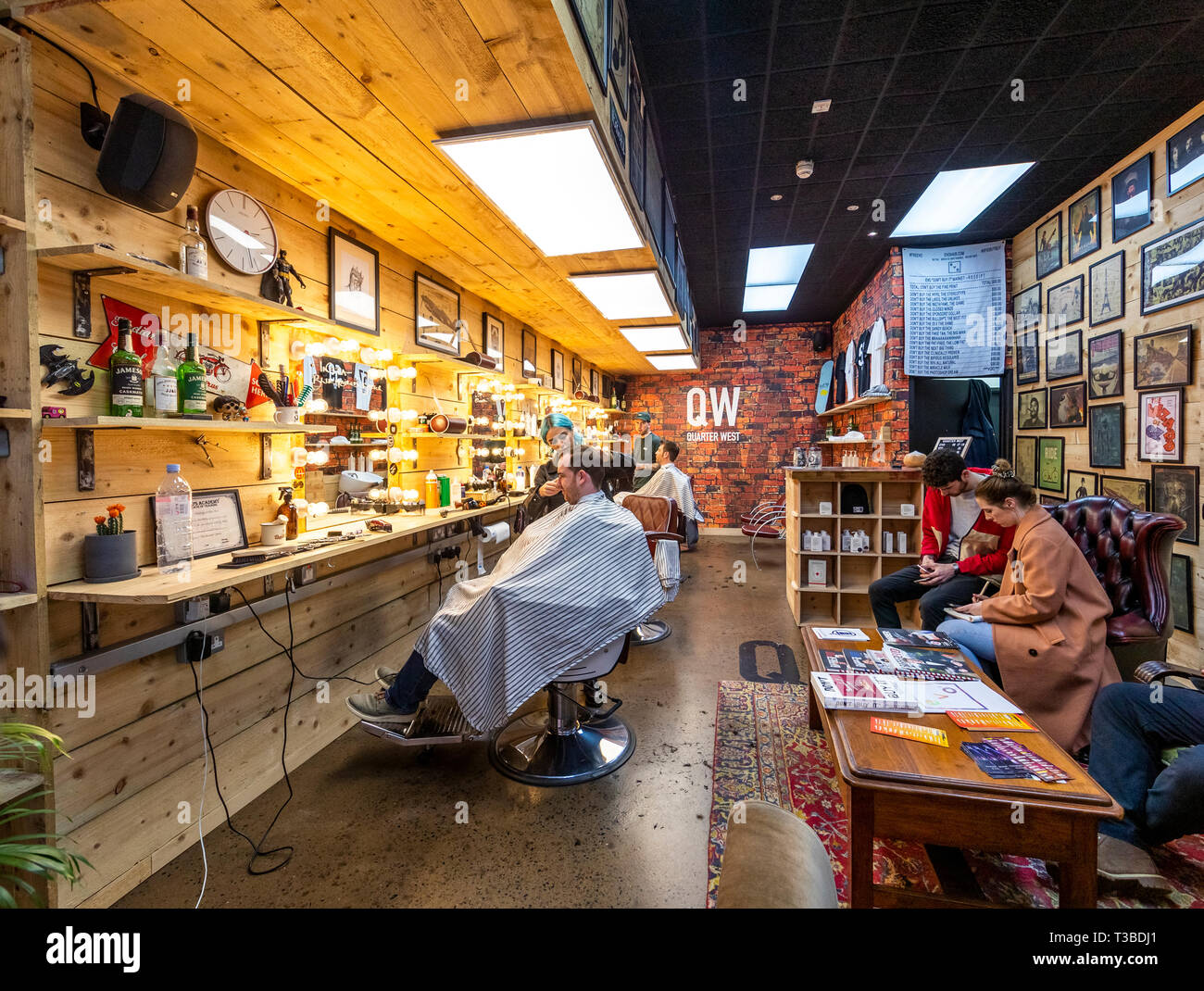 Style conscious men in Quarter West barbers shop in Pottinger's Entry
