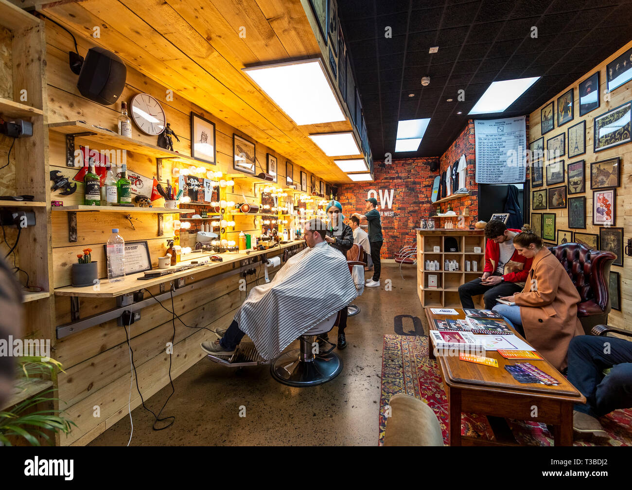 Style conscious men in Quarter West barbers shop in Pottinger's Entry