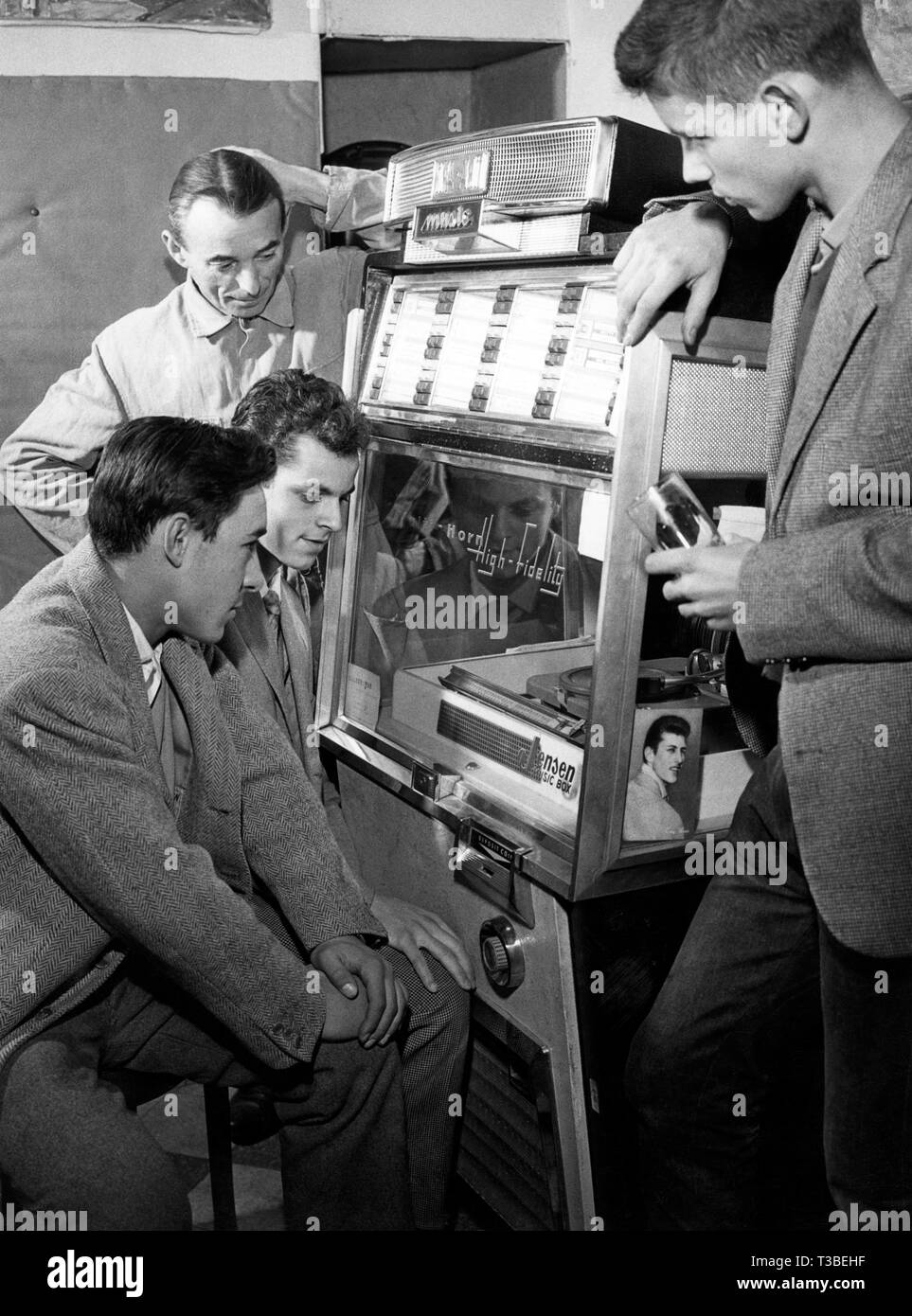 young men, juke box, 1968 Stock Photo