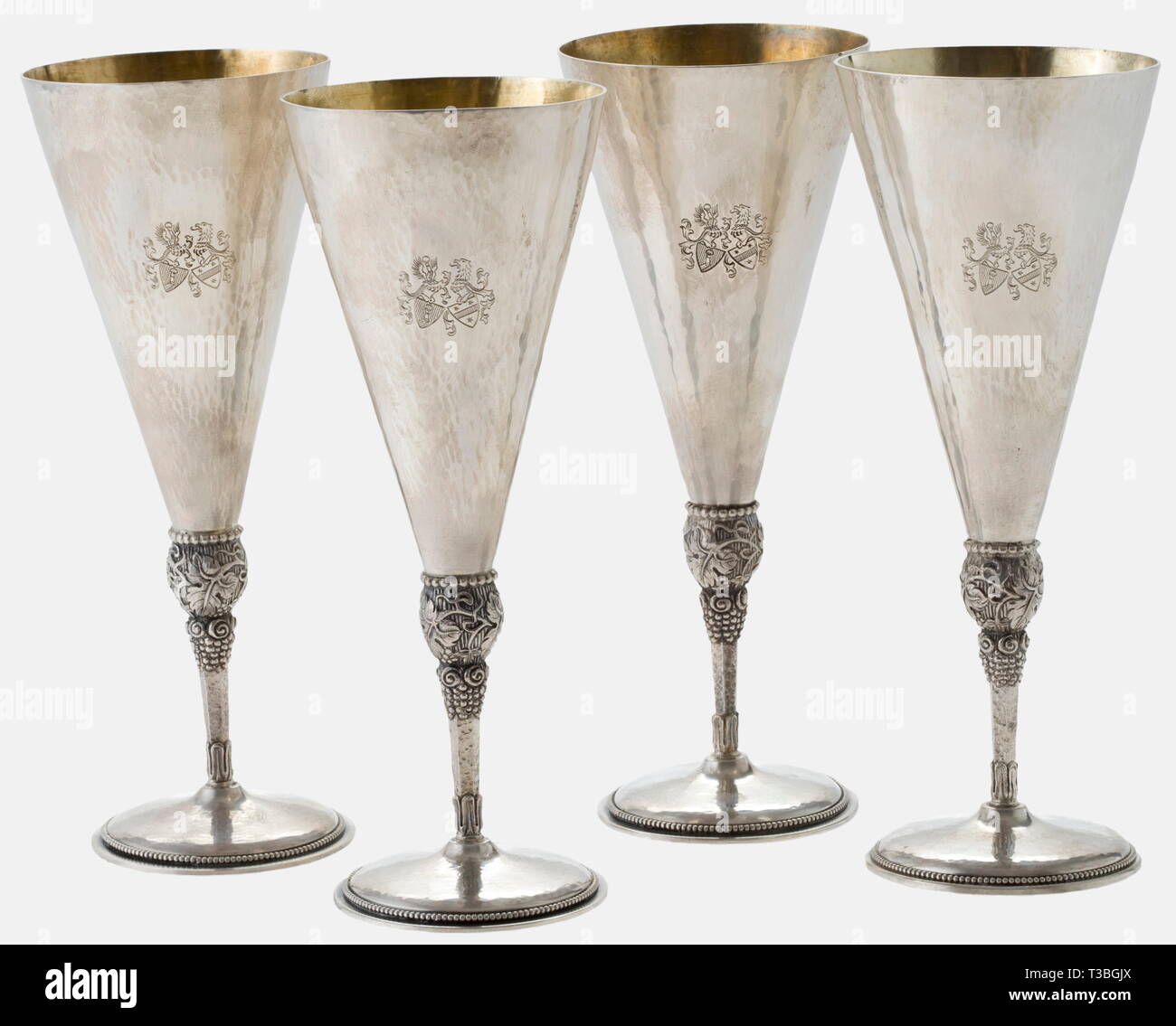 Hermann Göring and Emmy Sonnemann, four silver goblets, wedding gifts for the couple 1935 Hand-hammered silver, gilt interior, the obverse engraved with a alliance coat of arms. The stems with grape and vine leaf decoration in relief, the circular foot with the master's mark "Kleemann" and hallmark "925". Height of each goblet 18 cm, weight between 172 and 178 g. historic, historical, 1930s, 20th century, NS, National Socialism, Nazism, Third Reich, German Reich, Germany, German, National Socialist, Nazi, Nazi period, fascism, vessel, vessels, object, objects, stills, clipp, Editorial-Use-Only Stock Photo