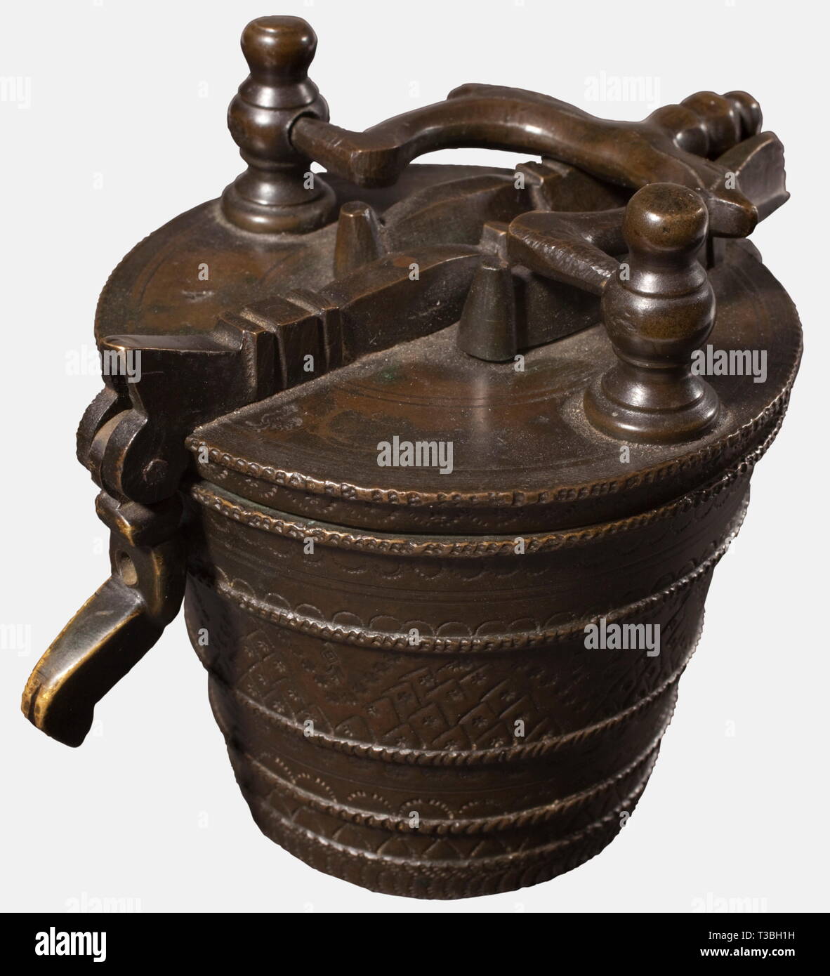 A nest-of-weights of 8 pounds, Nuremberg, 2nd half of the 18th century Brass with dark age patina. Conical casing with richly punched decorations. Hinged lid with closure lever and movable carrying handle. The inside fitted with eight out of originally ten stackable weights, the smallest weight probably associated. The lid punched '8' (pound) 'A' (Austria) along with the rooster mark of a Nuremberg founder. The casing marked with '4' on the inside, as well as an Austrian eagle mark. The insert weights of 2 and 1 pound, 16, 8, 4, 2 and 1 ounces. T, Additional-Rights-Clearance-Info-Not-Available Stock Photo