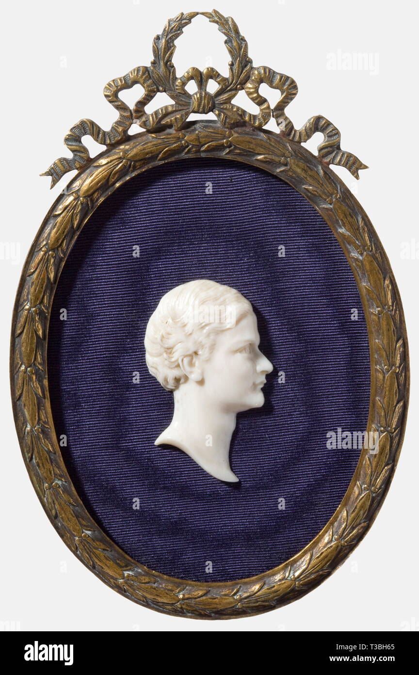 King Otto of Greece (1815 - 1867), a profile portrait carved in ivory Ivory, fine, elaborate work, not signed. On dark blue ribbed silk and in a brass frame with laurel decoration and surmounted by a laurel wreath. Dimensions 11.5 x 7.5 cm. people, 19th century, object, objects, stills, clipping, clippings, cut out, cut-out, cut-outs, man, men, male, Additional-Rights-Clearance-Info-Not-Available Stock Photo