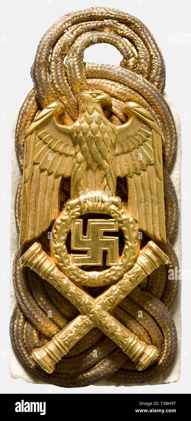 Hermann Göring, a pair of shoulder boards as Reich Marshal Woven of three round golden cords alongside each other on a white backing, bearing a party eagle looking forward above crossed marshal's batons. Massive solid silver castings (no hallmark), fire-gilded, and polished on the edges. Pieces cut from his uniform when he was taken prisoner. Obvious signs of wear. Cf. Johnson, 'World War II German War Booty', vol. IV, p. 105. Extremely rare. For the decisive victories of the German Luftwaffe during the campaign in France and in order to emphasise Hermann Göring's position , Editorial-Use-Only Stock Photo