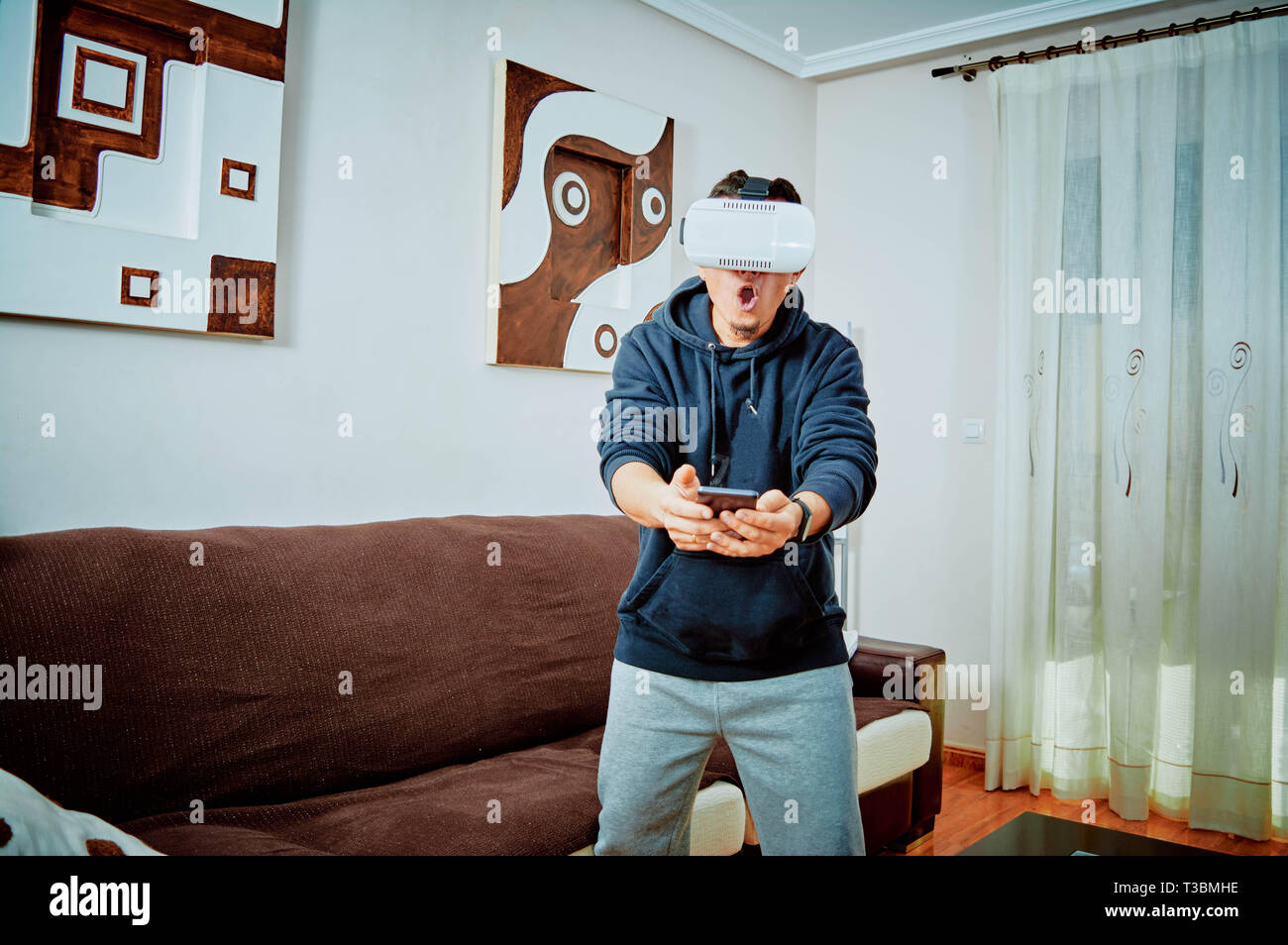 Young boy playing video games with 3d glasses Stock Photo