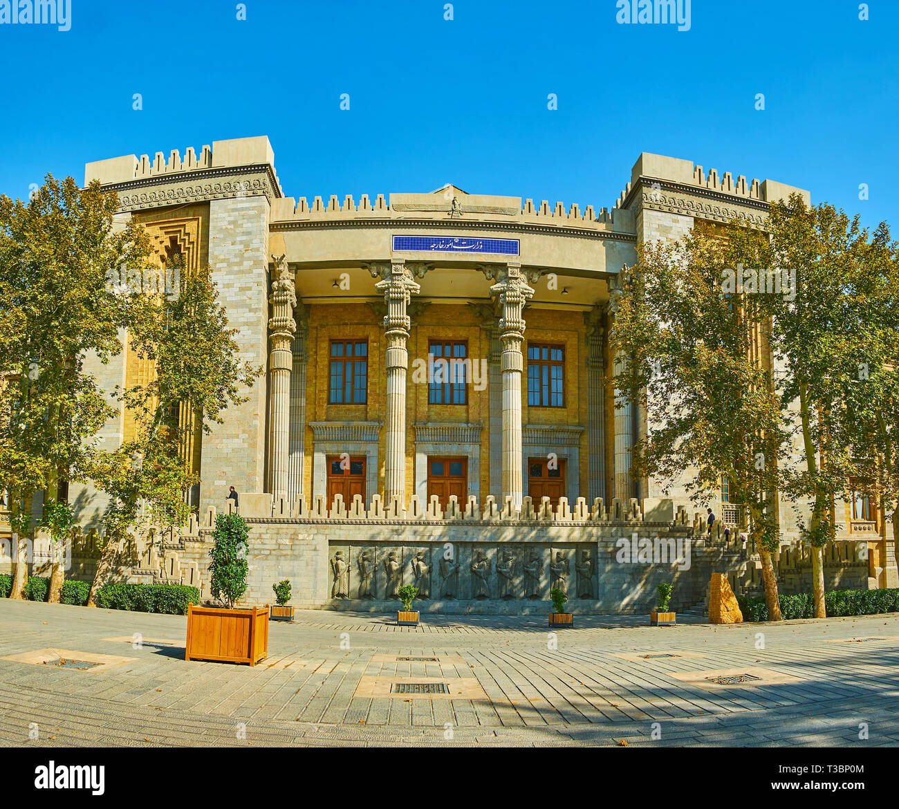 TEHRAN, IRAN - OCTOBER 25, 2017: Ministry of Foreign Affairs decorated in ancient manner with Persian columns and reliefs of Persian warriors on stair Stock Photo