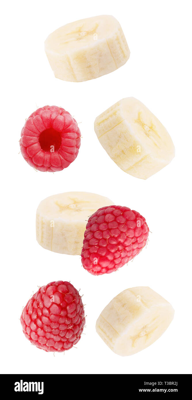 Flying slice banana and raspberry fruits isolated on white background ...