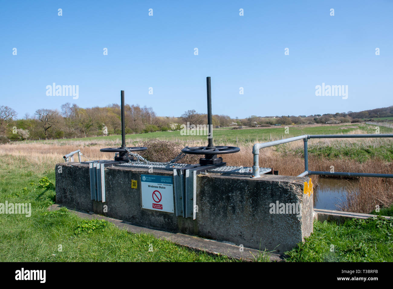 Wrabness Suffolk Uk  - 1 April  2019:  Flood control sluice used for water management on flood plain Stock Photo