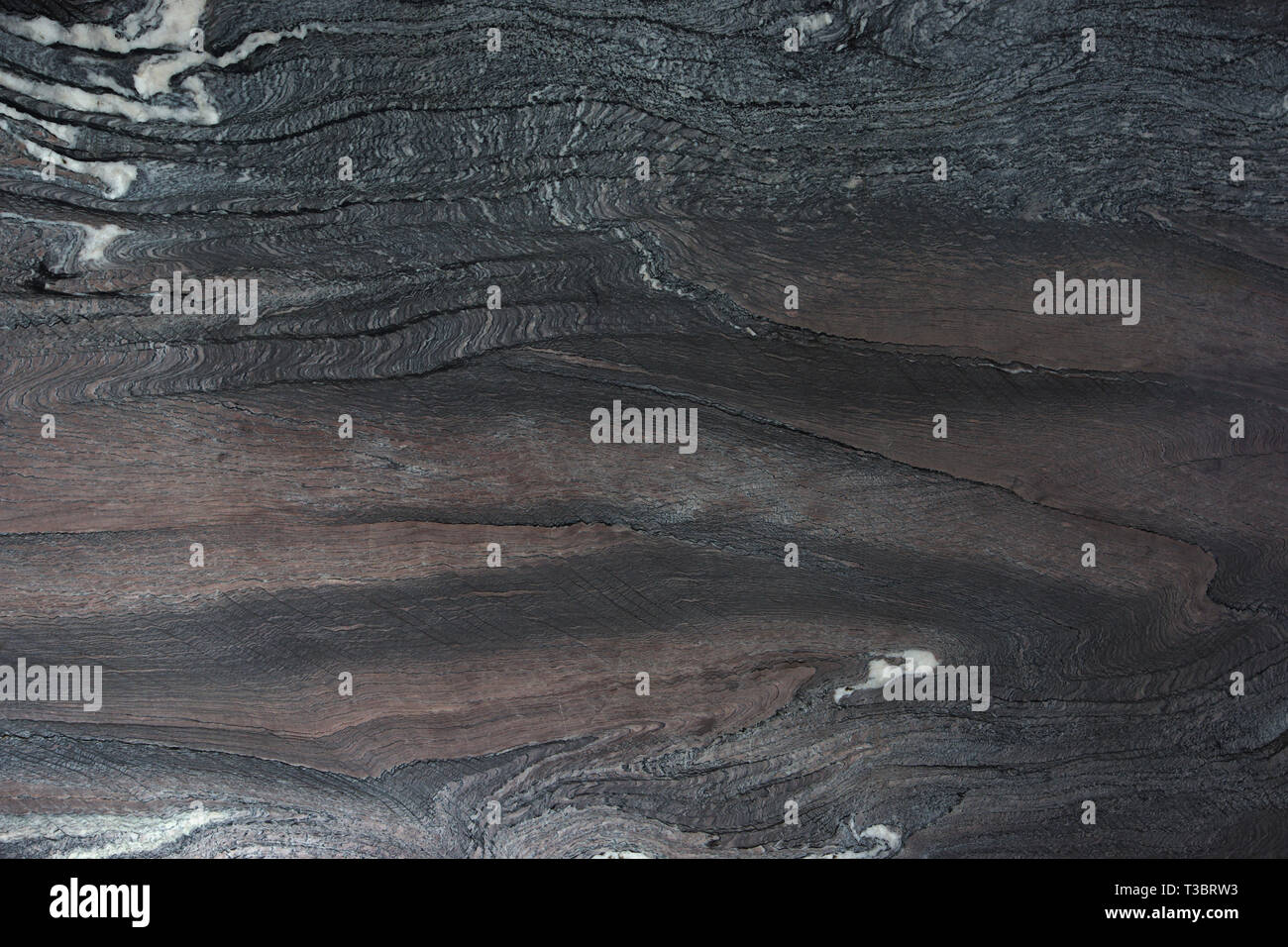 Natural dark stone with beautiful patterns called Rosso Luana quartzite ...