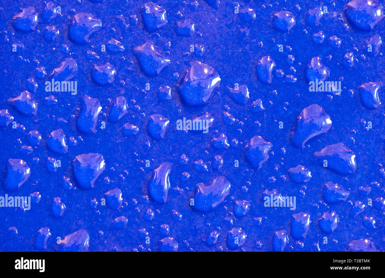 Water droplets on blue tiles Stock Photo - Alamy