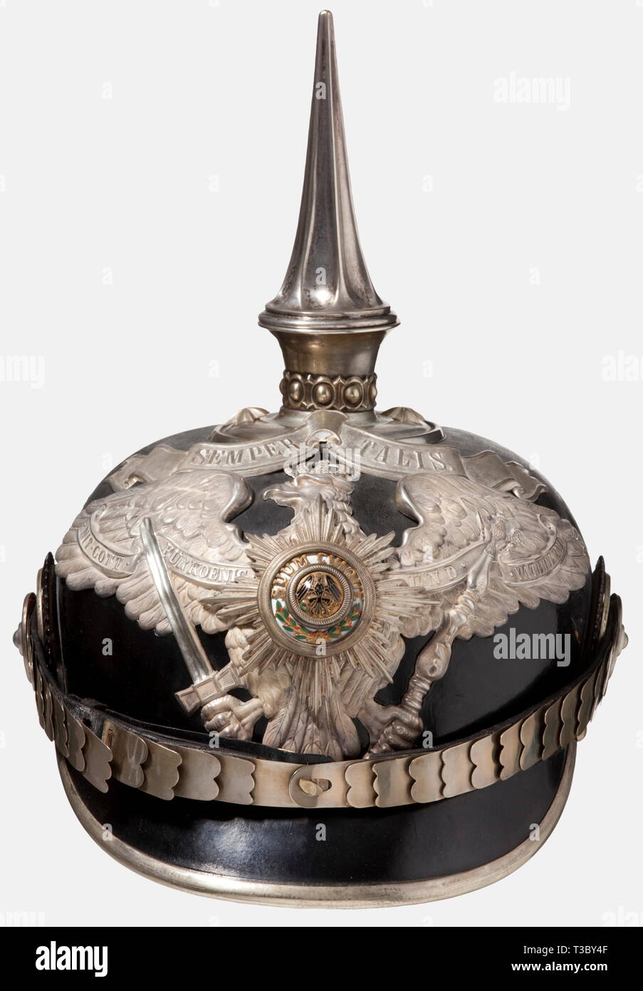 A helmet for officers of the 1st Foot Guards Regiment, Potsdam, circa 1910 A tall officer's helmet in the rare version with the 'SEMPER TALIS' scroll awarded to the 1st Battalion and the regimental staff on 27 January 1889. Black lacquered leather body. Partially frosted and polished silver-plated mountings. Circular crown plate with a fluted spike. Guards eagle with a strongly cambered, enamelled guard star. Silver-plated flat metal chinscales on silver-plated rosettes. Both cockades. Light-coloured sweatband and ribbed silk lining (loose in bac, Additional-Rights-Clearance-Info-Not-Available Stock Photo