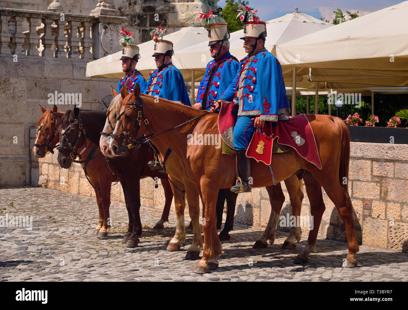 Hungary, Budapest, Hungarian Hussars Traditional Group in uniform on horseback at Buda Castle posing as a tourist attraction. Stock Photo