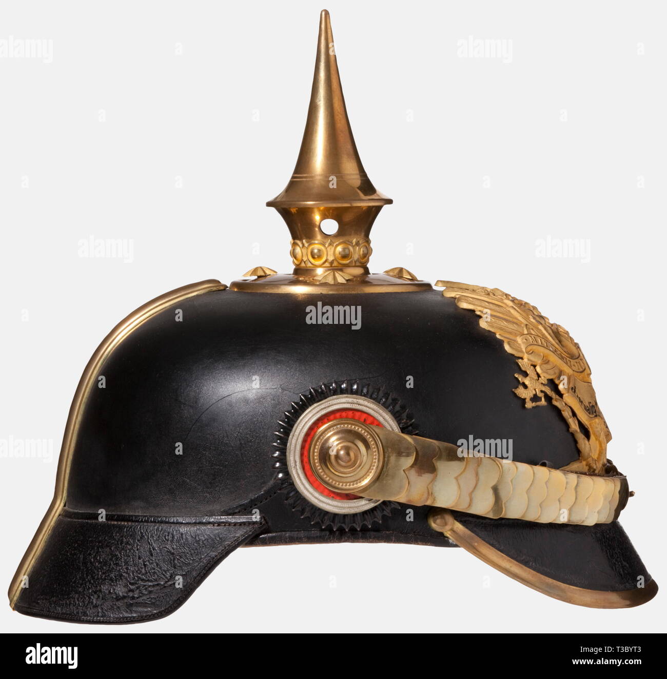 A helmet for officers of the Prussian Fusilier Regiment No 34, Stettin Garrison, circa 1910 Blackened leather body, gilded mountings. Circular crown plate with star screws and a smooth spike. Flat metal chinscales on rosettes. Both cockades. Line unit eagle with the scroll they were awarded, 'For Distinction, to the Former Royal Swedish Guards Regiment, Queen'. Light-coloured leather sweatband and ribbed silk lining. Army HQ awarded this distinction scroll after the Wars of Liberation on 17 April 1816 to the 1st Battalion of the 33rd Infantry Reg, Additional-Rights-Clearance-Info-Not-Available Stock Photo