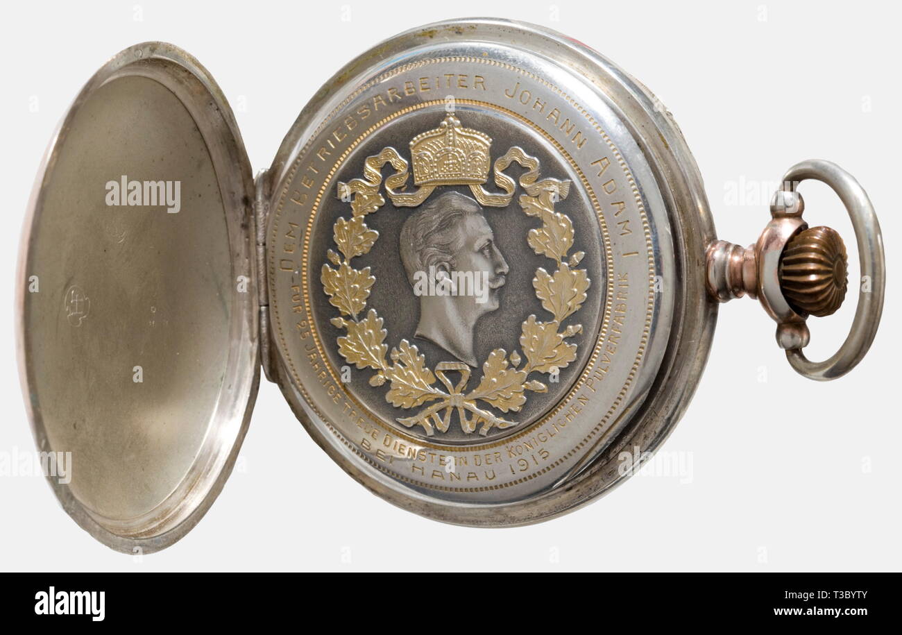 Kaiser Wilhelm II - Johann Adam, a presentation pocket watch Silver case, partially gilded. The lid bears the Imperial cipher 'W'. The dust cap displays a wreathed and crowned portrait of Wilhelm II and the dedication inscription, 'Für 25 Jährige treue Dienste in der Königlichen Pulverfabrik bei Hanau 1915 Dem Betriebsleiter Johann Adam I'. (To the Managing Director Johann Adam I For 25 years of Loyal Service at the Royal Powder Factory at Hanau 1915). Enamelled dial. Simple blued lancet hands. Separate second dial. Manufacturer's mark, 'HF'. Mov, Additional-Rights-Clearance-Info-Not-Available Stock Photo
