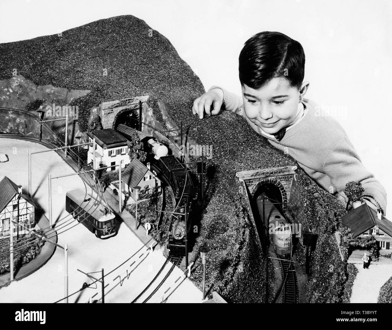 plastic model, young boy with electric train, 1955 Stock Photo